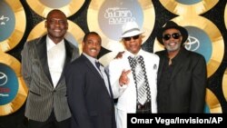 FILE - George Brown, Ronald Bell, Dennis Thomas and Robert "Kool" Bell of Kool & the Gang arrive for the 2014 Soul Train Awards in Las Vegas, Nev., Nov. 7, 2014. Thomas, a founding member of the group, died Aug. 7, 2021, at age 70. 