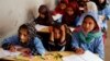 FILE - Afghan girls attend a class at the Aschiana center in Kabul, Afghanistan March 5, 2019. 