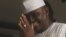 Maj. Hamza Al-Mustapha leaves the court after a verdict in Lagos, Nigeria, on Monday, Jan. 30, 2012.