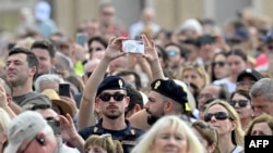 FILE - Policemen patrol amongst the crowd during Pope Francis's Sunday Angelus prayer in St.Peter's Square at the Vatican on October 15, 2023. Pope Francis called on October 15, 2023 for humanitarian corridors to allow the delivery of essentials to the Gaza Strip.