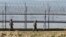 South Korean soldiers patrol along the military fences near the demilitarized zone (DMZ) separating North Korea from South Korea in Paju, north of Seoul Apr. 7, 2013.
