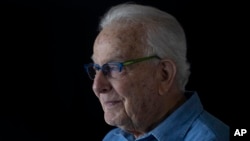 FILE - Holocaust survivor Naftali Furst pauses during an interview at home in Haifa, Israel, Jan. 14, 2025.