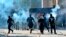 Iraqi security forces fire tear gas to disperse anti-government protesters during a demonstration in central Baghdad, Oct. 25, 2019. Iraqi police fired tear gas to disperse thousands of protesters.