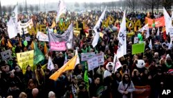 Demonstrators take part in a climate demonstration in Berlin, Germany, Saturday, Dec. 1, 2018. 