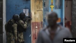 Haitian security forces take part in an anti-gang operation following a confrontation with armed gangs after prominent gang leader Jimmy Cherizier called for Prime Minister Ariel Henry's government to be toppled, in Port-au-Prince, on February 29, 2024. 