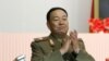 FILE - Recently executed then-Vice Marshal Hyon Yong Chol applauds during a meeting at the April 25 House of Culture announcing North Korean leader Kim Jong Un's new title of marshal.