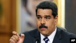 FILE - Venezuela's President Nicolas Maduro accuses the United States of trying to undermine the Caracas government.