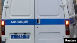 FILE - A police minivan is seen entering a Moscow detention facility.