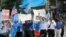 FILE - Uighur supporters march towards the Chinese Embassy after a Uighur protest rally at Dupont Circle in Washington, July 7, 2009. Sunday's violence in China's Xinjiang region between Muslim Uighurs and ethnic Han Chinese has killed at least 156.