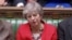 British Prime Minister Theresa May reacts after tellers announced the results of the vote Brexit deal in Parliament in London, Britain, March 12, 2019, in this screen grab taken from video.