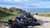 This photograph taken on Sept. 15, 2024 shows the damaged migrants' boat after a failed attempt to cross the English Channel that led to the death of eight people near the beach of Ambleteuse, northern France.