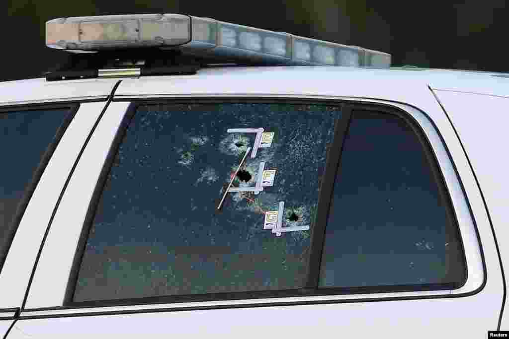 An East Baton Rouge Sheriff vehicle is seen with bullet holes in its windows near the scene where police officers were shot, in Baton Rouge, Louisiana, July 17, 2016.