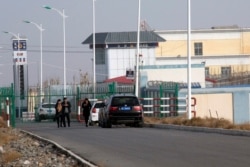 FILE.- A police station is seen by the front gate of the Artux City Vocational Skills Education Training Service Center in Artux in western China's Xinjiang region, Dec. 3, 2018.