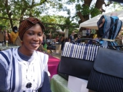 Mobarika Awudu, from Northern Pride Smocks, has seen livelihood improvements in the women she buys fabrics from, Dec. 6, 2020. (Stacey Knott/VOA)