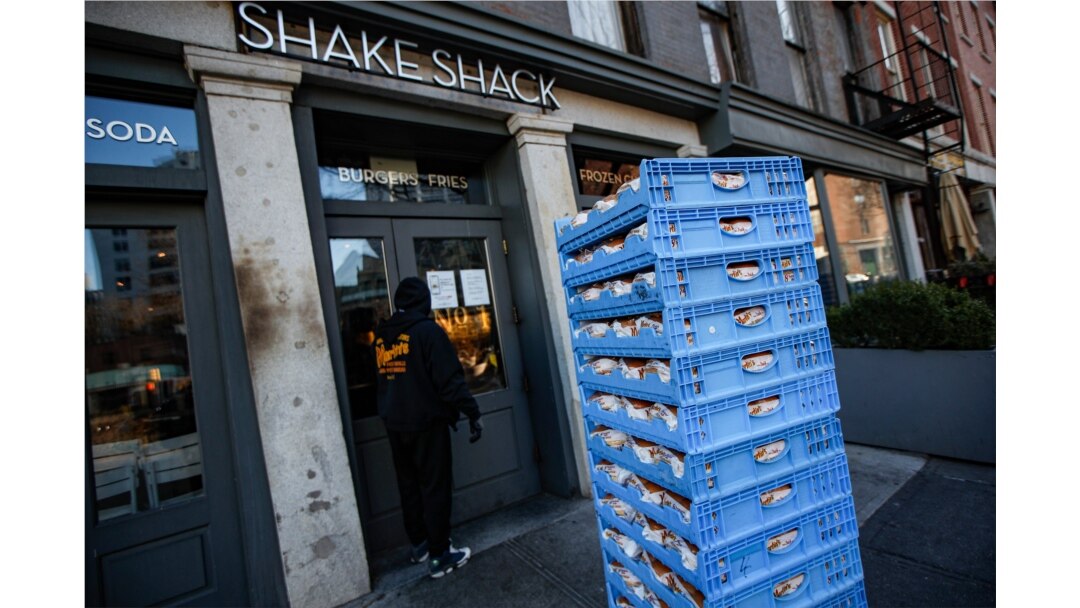 FILE - A bread delivery is made to a Shake Shack restaurant in the Brooklyn borough of New York, March 16, 2020.