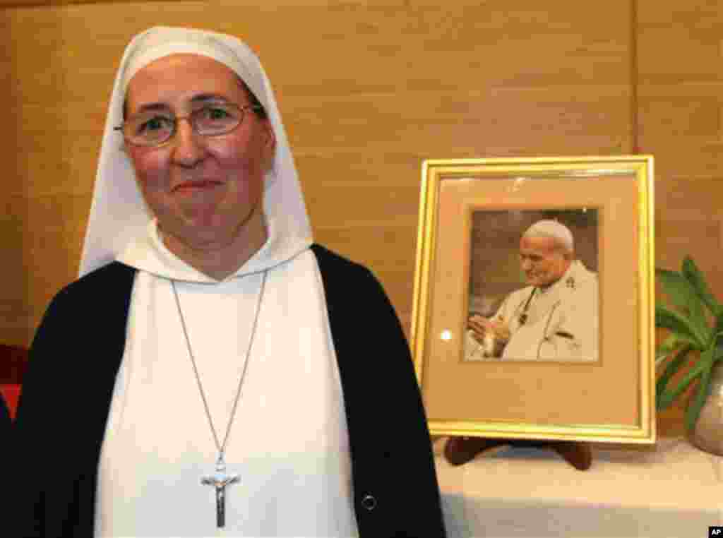 Sister Marie Simon-Pierre, is a French nun whose mysterious cure from Parkinson’s disease led to John Paul’s beatification, 2011 photo (AP Photo/Claude Paris)