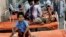 Indian children who fell ill after eating the daily free lunch at a rural Indian school undergo treatment at a hospital in Patna, India, July 18, 2013.