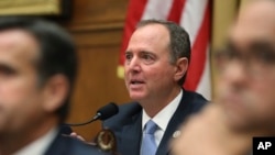 House Intelligence Committee Chairman Adam Schiff, D-Calif., questions former special counsel Robert Mueller, as he testifies before the House Intelligence Committee hearing on his report on Russian election interference, in Washington, July 24, 2019. 