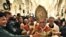Uskup agung Yerusalem membawa patung bayi Yesus setelah Misa Natal di Bethlehem, 25 Desember 2010.
