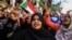 FILE - Sudanese women demonstrate in support of a civilian body to lead the transition to democracy, in Khartoum, April 12, 2019. Women say they were key forces in the Sudanese revolution and now deserve government leadership posts.