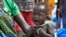 FILE - In this photo taken Dec. 10, 2017, a malnourished baby cries at the feeding center for children in Jiech, Ayod County, South Sudan. 