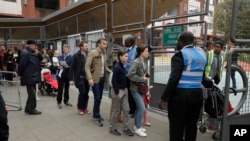 French expats queue up to vote in the French election at the Lycee Francais Charles de Gaulle school in the South Kensington district of London, May 7, 2017.