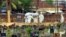 FILE - Doctors and relatives wearing protective gear carry the body of a victim, who lost his battle against the brain-damaging Nipah virus, during his funeral at a burial ground in Kozhikode, in southern India, May 24, 2018.