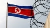 FILE - A North Korea flag flutters next to concertina wire at the North Korean embassy in Kuala Lumpur, Malaysia March 9, 2017.