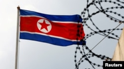 FILE - A North Korea flag flutters next to concertina wire at the North Korean embassy in Kuala Lumpur, Malaysia March 9, 2017.