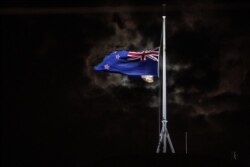 FILE - The New Zealand national flag is flown at half-staff on a Parliament building in Wellington on March 15, 2019, after attacks on two Christchurch mosques left more than 50 dead on March 15.