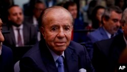 Former Argentine President Carlos Menem sits in a courthouse in Buenos Aires, Feb. 28, 2019, ahead of the verdict in a trial in which he and other former officials were accused of hampering the investigation of the attack on a Jewish center in Buenos Aires in 1994.