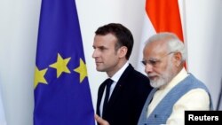 Presiden Perancis Emmanuel Macron dan PM India Narendra Modi di New Delhi (10/3). 