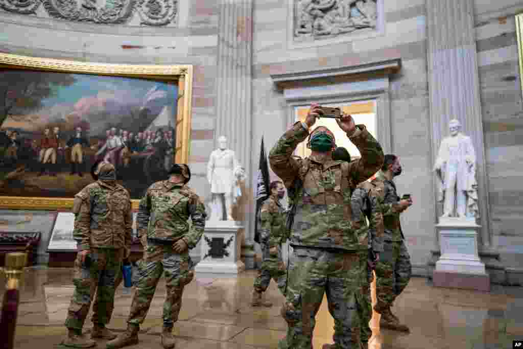 National Guard troops tour the Rotunda at the U.S. Capitol in Washington, D.C., during a break from reinforcing security.