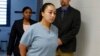 FILE - Cyntoia Brown enters her clemency hearing at Tennessee Prison for Women in Nashville, Tennessee, May 23, 2018.