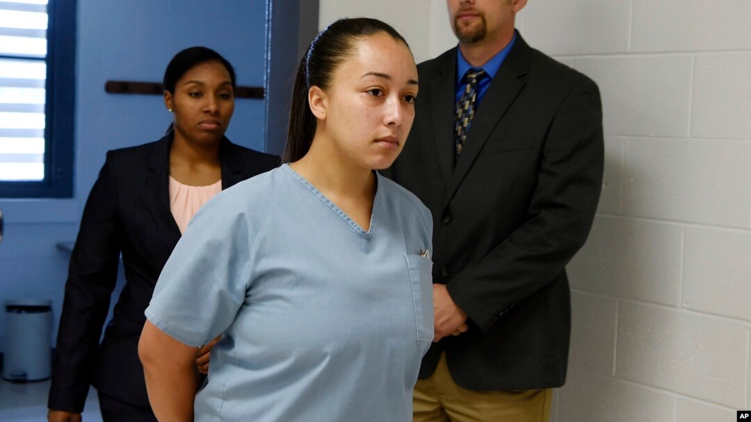 FILE - Cyntoia Brown enters her clemency hearing at Tennessee Prison for Women in Nashville, Tennessee, May 23, 2018.