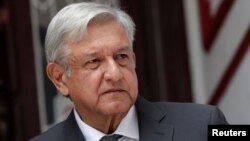 Mexico's incoming President Andres Manuel Lopez Obrador speaks to the media during a news conference at his campaign headquarters in Mexico City, Aug. 10, 2018. 