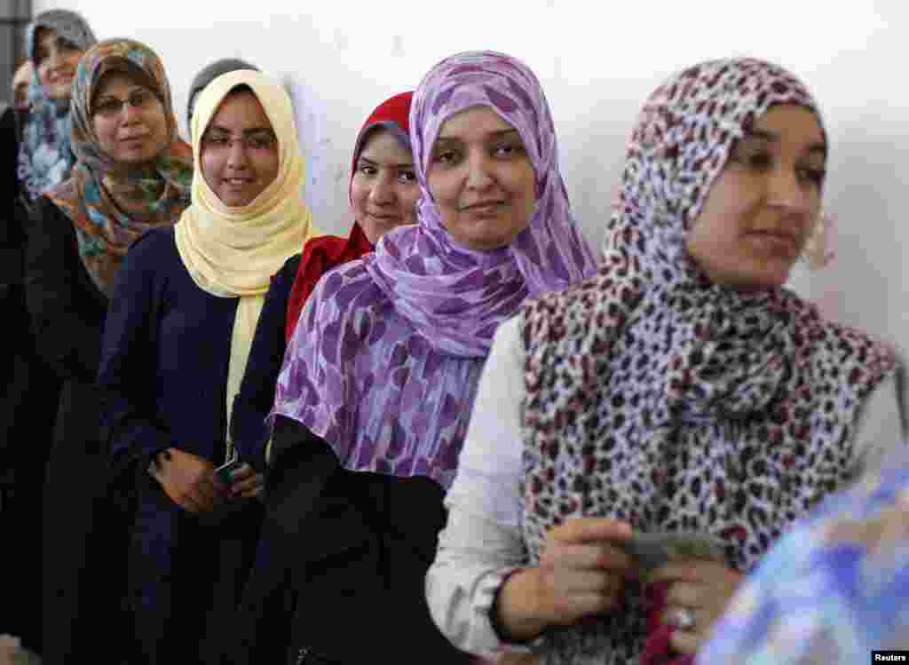 Women line up as they wait to cast their vote at a polling station in Tripoli July 7, 2012. Libyans began voting in their first free national election in 60 years on Saturday, a poll designed to shake off the legacy of Muammar Gaddafi but which risks bein