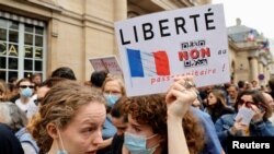 Demonstrators attend a protest against the new measures to fight the coronavirus disease outbreak, in Paris, France, July 17, 2021.