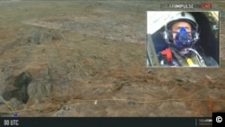 This screen grab from the Solar Impulse live stream shows Swiss pilot and businessman, Andre Borschberg, as he flies his solar plane over the Moroccan desert, June 13, 2012.