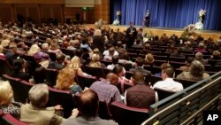 Larry Hubbard speaks during a memorial service held for church member and shooting victim Rhonda LeRocque, in the auditorium of Tewksbury Memorial High School Saturday, Oct. 14, 2017. 