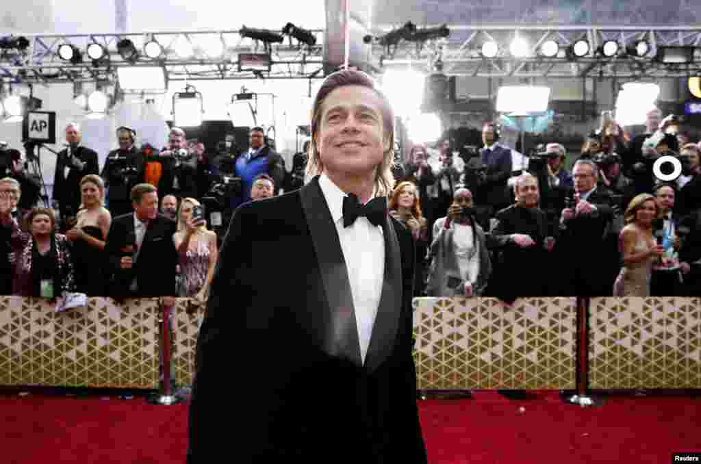 Brad Pitt poses on the red carpet during the Oscars arrivals at the 92nd Academy Awards in Hollywood, Feb. 9, 2020. 