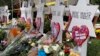 FILE - Flowers surround Stars of David on Oct. 31, 2018, part of a makeshift memorial outside the Tree of Life Synagogue to the 11 people killed in Pittsburgh.