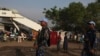 FILE - U.N. police officers patrol a United Nations camp for internally displaced persons in Juba.