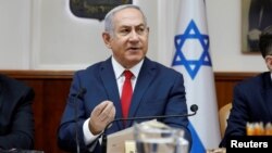 Israeli Prime Minister Benjamin Netanyahu attends the weekly cabinet meeting at his office in Jerusalem, July 8, 2018. 