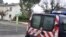 A French police vehicle is parked near a house where an alleged jihadist was arrested earlier on December 15, 2014, in Graulhet, southwestern France.