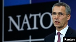 NATO Secretary General Jens Stoltenberg speaks at the alliance's headquarters during a NATO foreign ministers meeting in Brussels December 2, 2014.