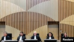 Judges attend the criminal trial against four suspects in the July 2014 downing of Malaysia Airlines flight MH17, in Badhoevedorp, Netherlands, March 10, 2020. 