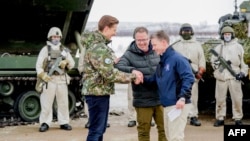 Defense ministers Antti Hakkanen of Finland, Bjorn Arild Gram of Norway and Pal Jonson of Sweden gather near the borders of all three countries, in Kilpisjarvi, Finland, on March 9, 2024.