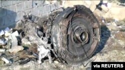 One of the engines of Ukraine International Airlines flight PS752, a Boeing 737-800 plane that crashed after taking off from Tehran's Imam Khomeini airport on Jan. 8, 2020, is seen in this still image taken from Iran Press footage.