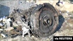 FILE - One of the engines of a Boeing 737 that was downed after taking off from Tehran's Imam Khomeini airport on Jan. 8, 2020, is seen in this still image taken from Iran Press footage. 